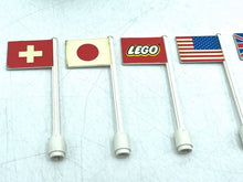 Carica l'immagine nel visualizzatore di Gallery, LEGO 939 detail close-up of multiple small country flags in red, white, blue, and yellow.
