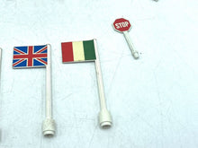 Carica l'immagine nel visualizzatore di Gallery, LEGO 939 detail close-up of three small country flags with various designs in red, white, blue, and yellow.
