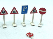 Carica l'immagine nel visualizzatore di Gallery, LEGO 939 detail close-up of five small warning traffic signs in red, blue, and white.
