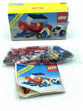 Carica l'immagine nel visualizzatore di Gallery, LEGO set with instruction manual displayed in open box on white background.
