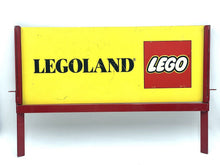 Carica l'immagine nel visualizzatore di Gallery, LEGO Legoland store display front view showing the iconic logo in yellow, red, and black.
