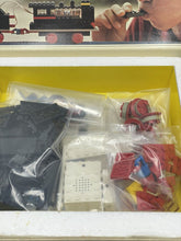 Load image into Gallery viewer, Packaging shot showing sealed accessories and colorful items for the action figure.
