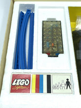 Load image into Gallery viewer, Packaging detail of the LEGO 118 set with remote control and blue cables.
