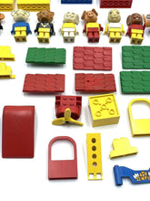 Carica l'immagine nel visualizzatore di Gallery, LEGO 70's Fabuland assorted building blocks in red, yellow, and green with various shapes on a white background.
