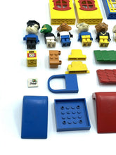 Carica l'immagine nel visualizzatore di Gallery, LEGO 70's Fabuland mini figures with accessories in blue, yellow, green, and red on a white background.
