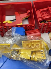 Carica l'immagine nel visualizzatore di Gallery, Close-up of colorful LEGO Duplo toy blocks showcasing various shapes.
