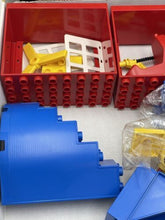 Carica l'immagine nel visualizzatore di Gallery, Detail shot of LEGO Duplo building block components including instruction sheets.

