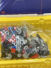 Carica l'immagine nel visualizzatore di Gallery, Gray LEGO components displayed in a storage bin, featuring different shapes.
