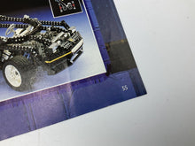 Carica l'immagine nel visualizzatore di Gallery, Packaging of a toy car featuring detailed graphics and brand logo in black, yellow, and blue.
