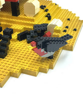 Carica l'immagine nel visualizzatore di Gallery, Front view of the LEGO house showcasing an open window and decorative elements.

