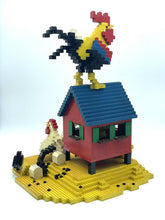 Carica l'immagine nel visualizzatore di Gallery, Lifestyle shot of a rooster on a barn with multiple chickens.
