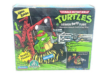 Load image into Gallery viewer, BANDAI Playmates TMNT Sewer Party Tube packaging view with colorful graphics.
