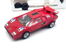 Load image into Gallery viewer, Side view of Takara Transformers G1 Sideswipe highlighting the red toy car's spoiler and detailed wheels.
