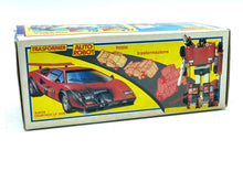 Load image into Gallery viewer, Takara Transformers G1 Sideswipe toy car packaging with colorful graphics and illustrated car.
