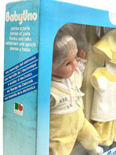 Carica l'immagine nel visualizzatore di Gallery, Front view of Sebino Baby Uno doll packaging with blue, white, and yellow colors.
