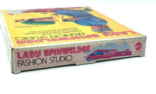 Load image into Gallery viewer, Mattel 1974 Lady Spinwelder Fashion Studio Kit side view highlighting the vibrant game title and design.
