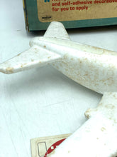 Load image into Gallery viewer, Detail view of Mettoy airplane model showing smooth white surface.
