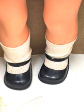 Load image into Gallery viewer, Italocremona Fanni doll close-up of black shoes with straps and socks.
