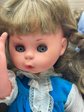 Load image into Gallery viewer, Close-up detail of Italocremona Fanni doll, showcasing curly hair and blue eyes.
