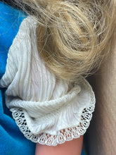 Load image into Gallery viewer, Italocremona Fanni doll close-up of ruffled sleeve detail in white and blue.
