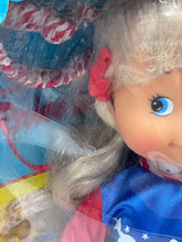 Carica l'immagine nel visualizzatore di Gallery, Furga Doll packaging corner detail showing colorful design and part of the doll.
