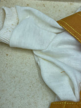Load image into Gallery viewer, Close-up of white fabric used in Sebino doll dress highlighting its soft texture.
