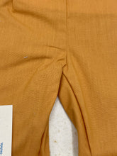 Load image into Gallery viewer, Detail of smooth yellow fabric used in Sebino doll dress.
