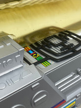 Load image into Gallery viewer, Detail view of a silver printer cartridge showing control panel and color labels.
