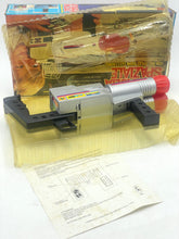 Load image into Gallery viewer, Ceppiratti detail view of the toy gun inside the box with instructions and transparent cover.
