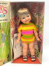Load image into Gallery viewer, Ideal Toy Giggles doll front view in original packaging with colorful design.
