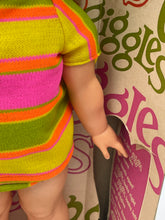 Load image into Gallery viewer, Detail of Ideal Toy Giggles doll's striped outfit in pink, green, and yellow.
