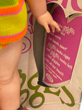 Load image into Gallery viewer, Detail of Ideal Toy Giggles doll's striped outfit in pink, green, and yellow.
