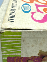 Load image into Gallery viewer, Ideal Toy Giggles doll side view of the packaging highlighting vibrant colors.
