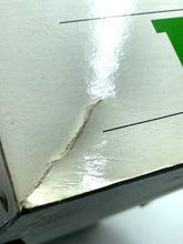 Load image into Gallery viewer, Detail of damaged Sebino Doll packaging with a dent and glossy finish.
