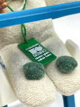 Load image into Gallery viewer, Detail of Vintage Sebino Ciccinobello Bimbo Giallo's white plush feet with green tag.
