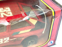Load image into Gallery viewer, Close-up detail of the Audi Quattro Rallye toy car highlighting colorful decals and number 32.
