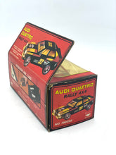 Load image into Gallery viewer, Open top packaging view of the Audi Quattro Rallye toy car with graphic design and brand logo.
