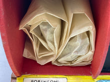 Load image into Gallery viewer, Detail view of rolled papers packaged together.
