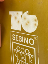 Load image into Gallery viewer, Close-up of the logo on Sebino doll's packaging with graphic design.
