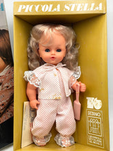 Load image into Gallery viewer, Sebino doll in packaging with accessories visible through a transparent front.
