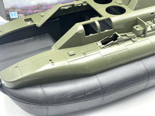 Load image into Gallery viewer, Detail view of the green and gray boat hull with open cockpit.
