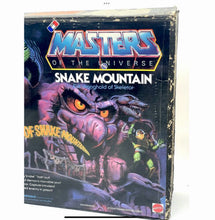 Load image into Gallery viewer, Mattel Masters of the Universe Snake Mountain packaging front view highlighting colorful design.

