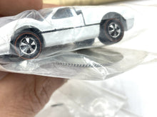 Load image into Gallery viewer, Detail close-up of the Ford J Car in plastic packaging with detailed wheels
