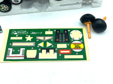 Load image into Gallery viewer, Detail of the sticker sheet featuring military-themed stickers in various colors.
