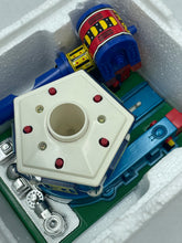 Load image into Gallery viewer, Close-up of colorful toy components from the Popy Combattra V set.
