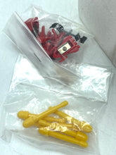 Load image into Gallery viewer, Detail of red and yellow components from the Popy Combattra V toy in plastic packaging.
