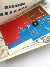 Load image into Gallery viewer, Detail close-up of the circuit board with printed circuits in red, blue, and gold.
