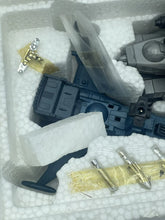 Load image into Gallery viewer, Model parts view showing styrofoam packaging with various components in black, white, and yellow.

