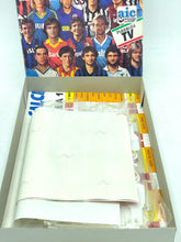 Load image into Gallery viewer, Open box of players displaying team images and text overlay in blue, white, and red.
