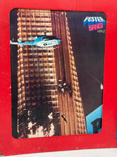 Load image into Gallery viewer, Front view of the game packaging featuring a city skyline and helicopter graphic.
